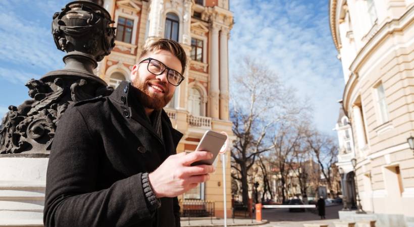 man-coat-street-smartphone-buildings-architecture-museum-tech
