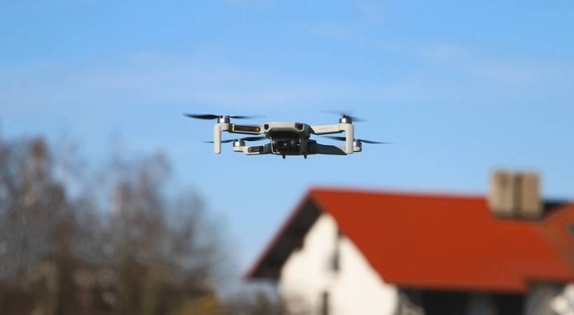 drone-flying-over-house-micro-camera-applications-in-industries