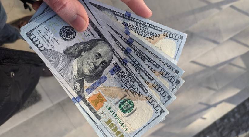 hand-holding-dollar-notes-improve-financial-health