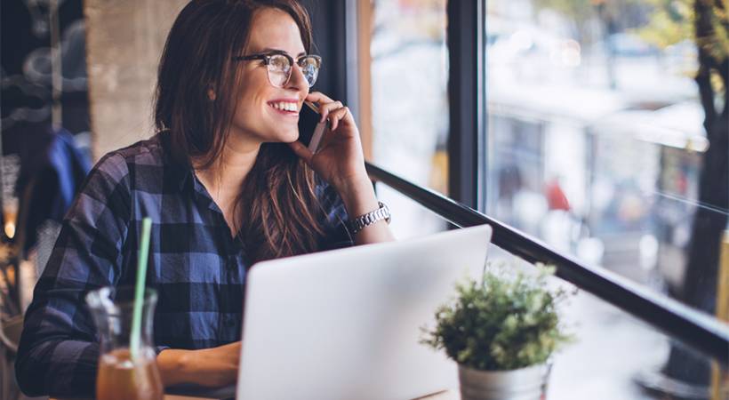 Female Entrepreneur on Phone Image for Personal Traits for Successful Entrepreneurship