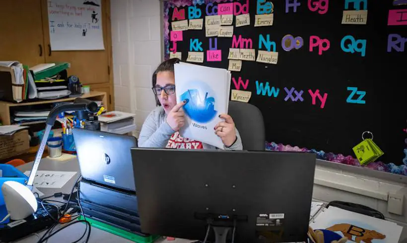 teacher uses her student-less classrooms as the setting for her online classes