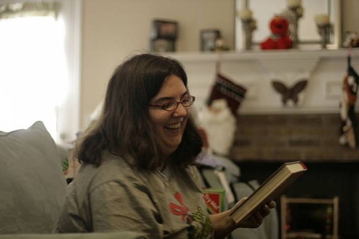 Woman-Smiling-Admiring-Book-Christmas-Ideasfor-Book-Lovers