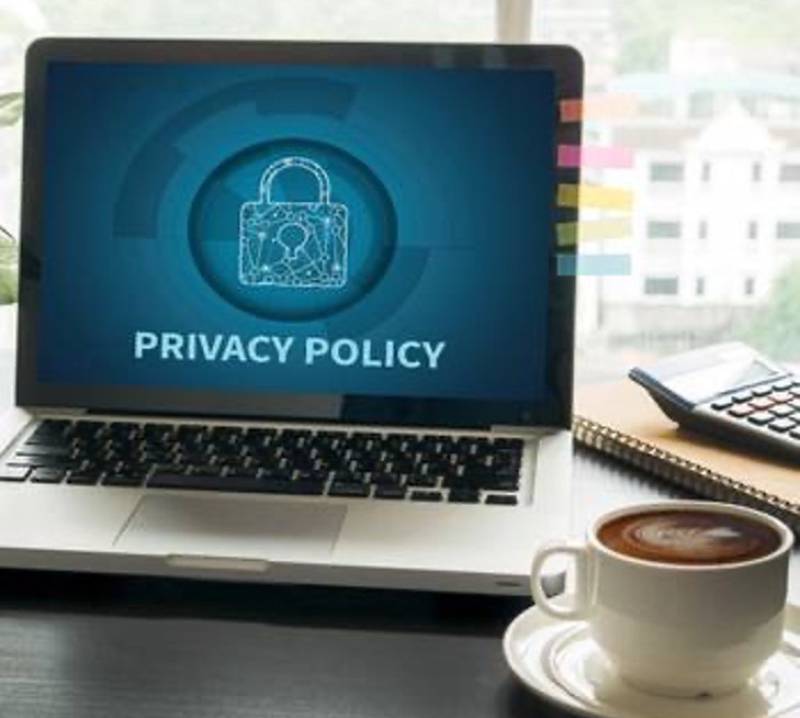 laptop-privacy-policy-logo-cup-of-coffee-on-table