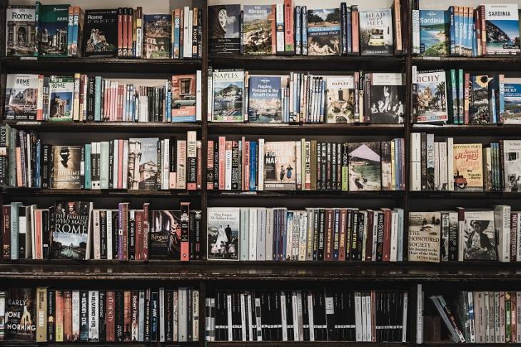 Books in Library Shelf Image for Six Trending Book Cover Design Ideas & Principles in 2021