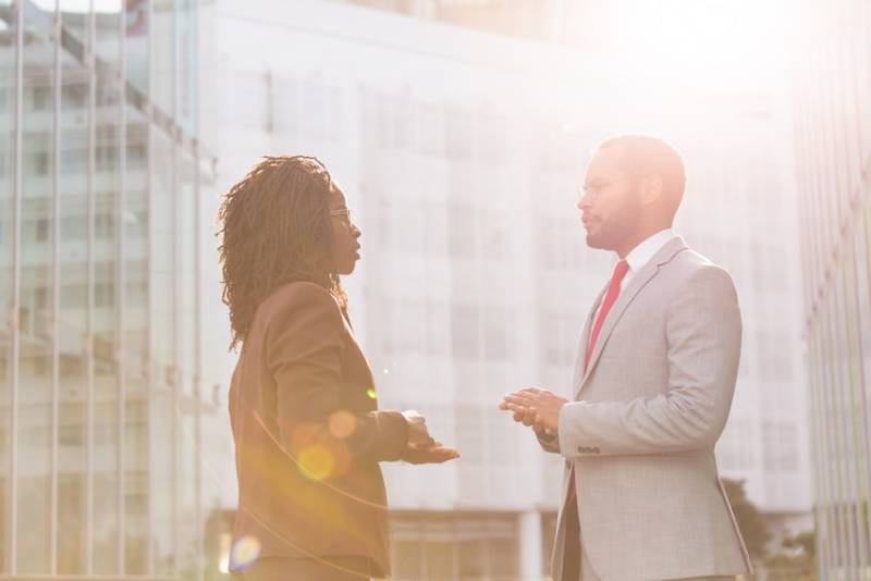 business_man_woman_ colleagues_discussing_gender equality