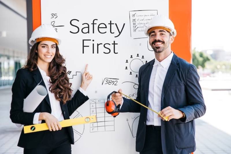 business-man-woman-whiteboard-safety-first