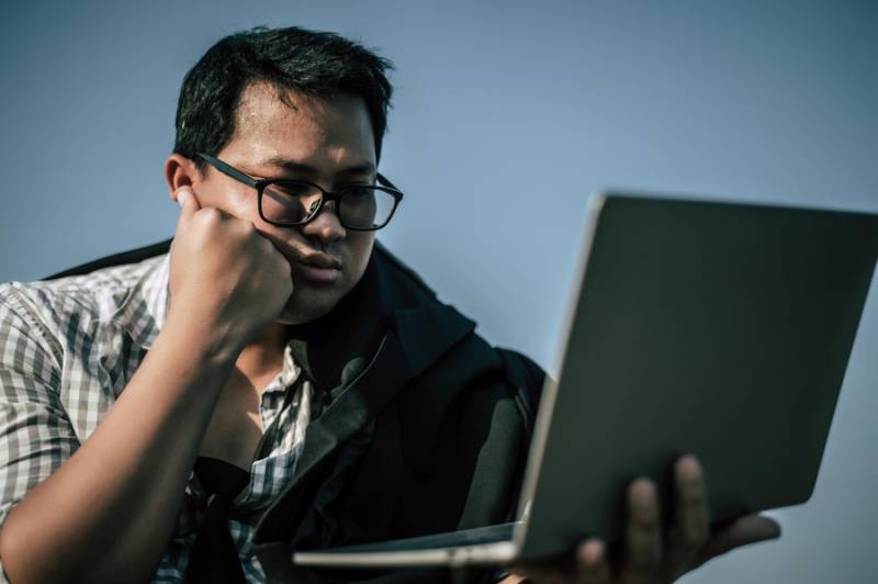 Tech Troubles? 4 Key Business Strategies To Avoid Tech Disasters businessman-with-laptop-tech troubles-software-problems-distress-disappointment