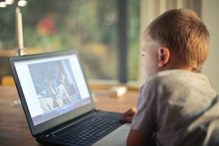 small-boy-using-laptop - Raising Kids in the Digital World: Screen Time Stats &amp; Tips - illustration