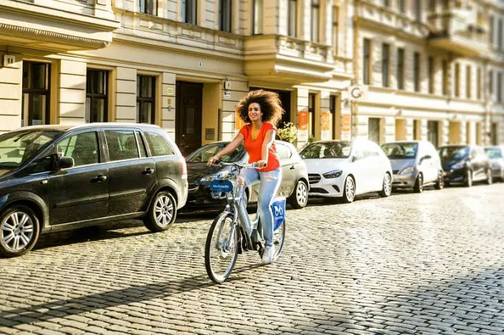 young-woman-riding-bicycle-city-active-life