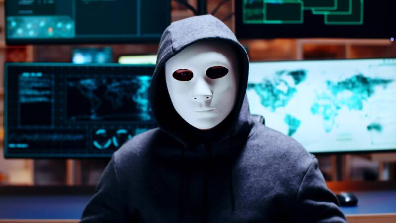 cyber-criminal-wearing-white-mask-guard-agains-malwake-back-up-data