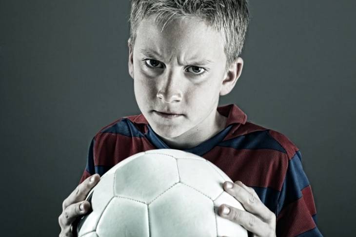 boy-holding-soccer-ball-disruptive-mood-dysregulation-disorder