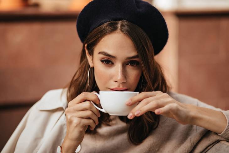 13 Best Tasting Decaf Coffee You Must Try elegant-young-woman-drinking-coffee-from-white-cup