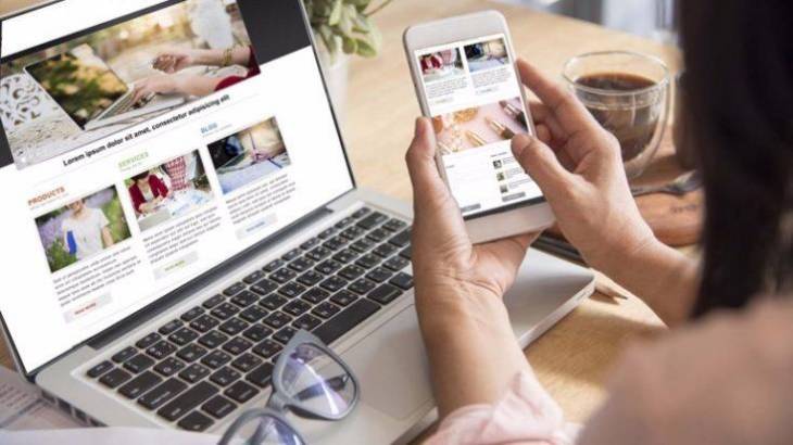 woman-checking-laptop-and-smartphone-elements-of-successful-website