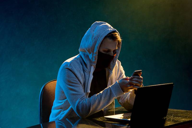 hooded-hacker-laptop-cybersecurity