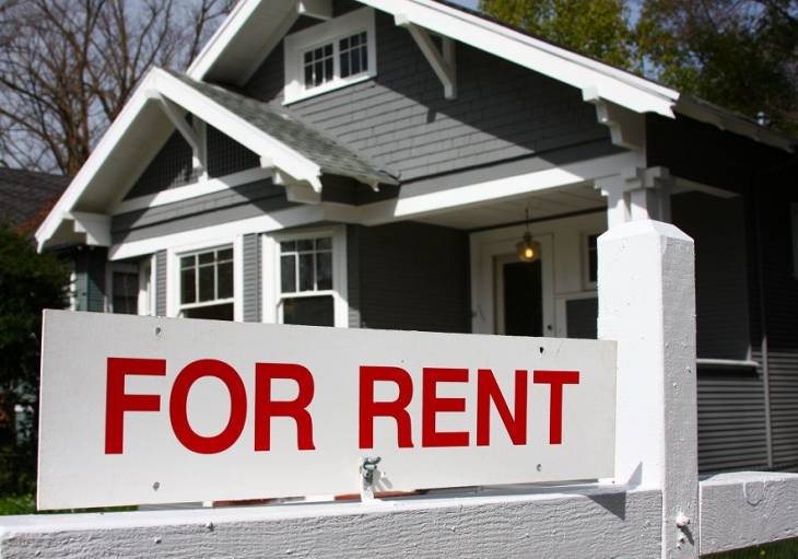 For Rent Sign in front of House