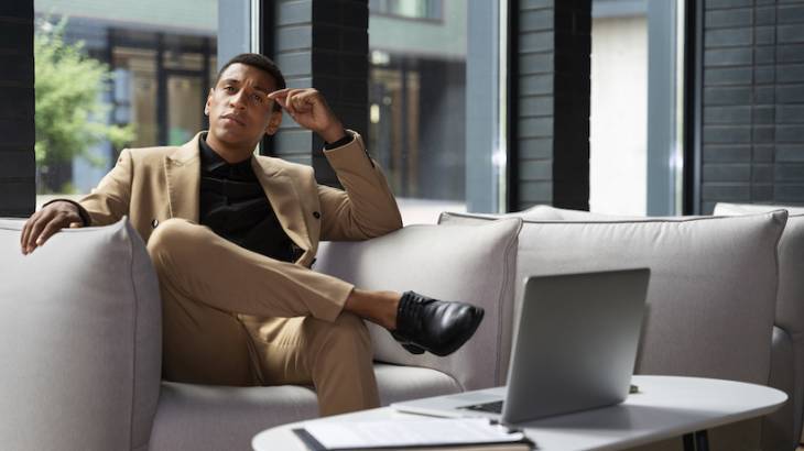 Best Entrepreneur Resources, Opportunities to Start and Grow a Business smart-business-man-entreprenur-sitted-on-couch-pensive