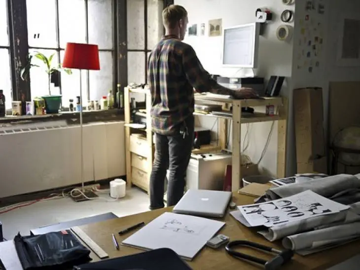 man-standing-while-working-at-home