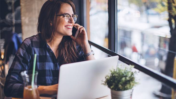 Female Entrepreneur on Phone Image for Personal Traits for Successful Entrepreneurship