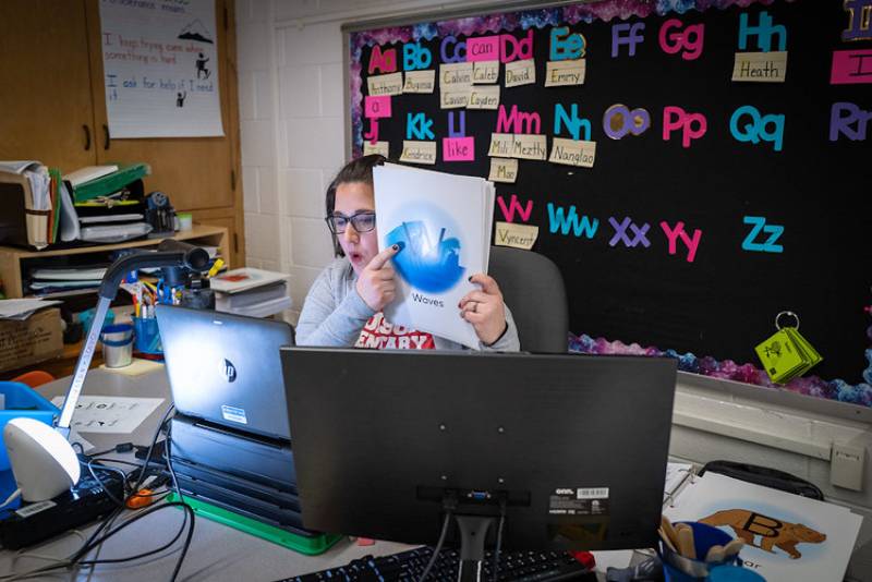 teacher uses her student-less classrooms as the setting for her online classes