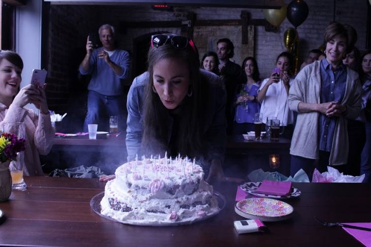 woman-blowing-candle Image for Cute & Creative Décor Ideas for a Memorable Birthday Party