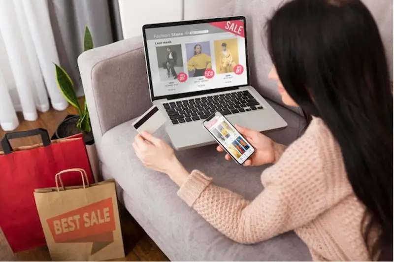 woman-laptop-smartphone-shopping-online-holding-credit-card