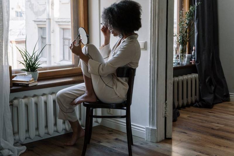 woman-skincare-routine-by-the-window