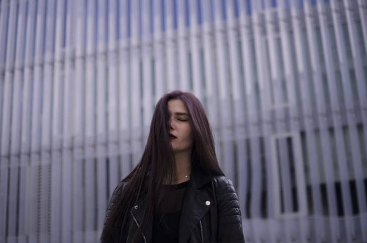 woman-long-hair-eyes-closed-pensive