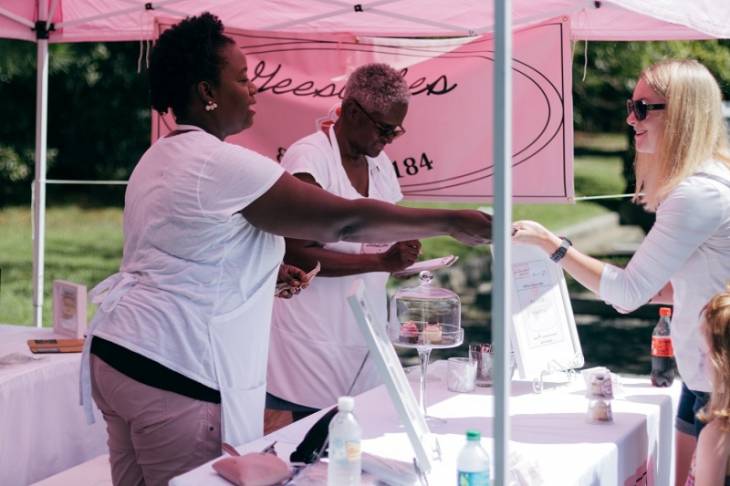 women-engage-visitors-at-exhibition-stand