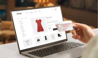 ecommerce web page with woman clothes on laptop display