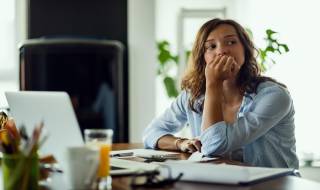 young-woman-worried-thinking-debt-relief-scam-debt-consolidation