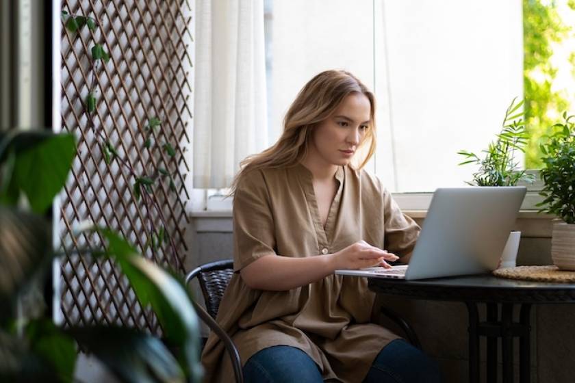 woman-working-on-laptop-hiring-freelancer