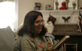 Woman-Smiling-Admiring-Book-Christmas-Ideasfor-Book-Lovers