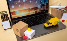 Vehicles on laptop supply chain management representation.