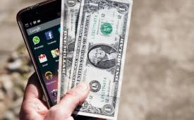 Smartphone and Dollar Bills Image for App Monetization Trends You Should Not Ignore