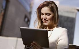 Businesswoman Happy With Tablet Image for Advice Every Entrepreneur Needs to Hear for Success