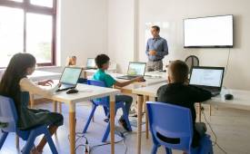 classroom-teacher-explaining-lesson-pupils-pros-cons-of-AI-in-education