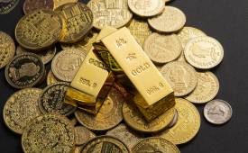 coins-gold-bars-scattered-table