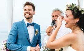 couple-next-to-elderly-man-giving-wedding-speech