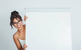 happy-businesswoman-hiding-whiteboard