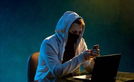 hooded-hacker-laptop-cybersecurity