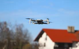 drone-flying-over-house-micro-camera-applications-in-industries