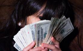 woman-holing-money-personal-finances