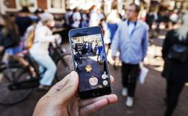 person-holding-smartphone-pokemon-go-app-image