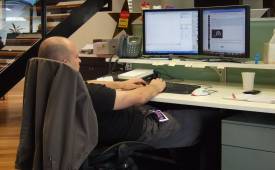 man-in-office-sitted-bad-posture-while-working