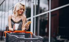pretty-woman-with-shopping-cart-outside-phygital