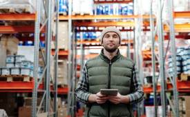 retailer_holding_tablet_warehouse_flexible_automation