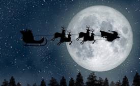 santa-claus-flying-sleigh-over-moon-night-sky
