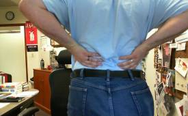 man-clutching-back-pain-sciatica