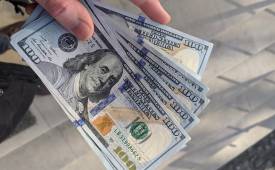 hand-holding-dollar-notes-improve-financial-health