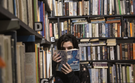 woman-holding-book-library-home-business-ideas-for-people-who-love-books
